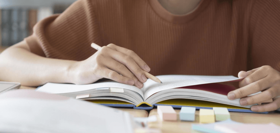 65bf8c20056b19cb834dfaff close-up-of-student-studying-free-photo 1